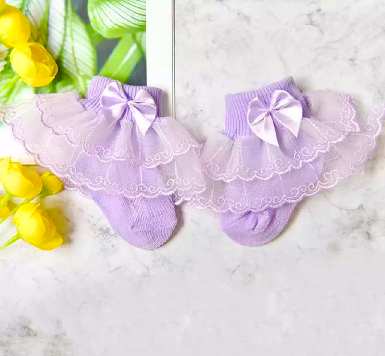 Socks with frills and a bow