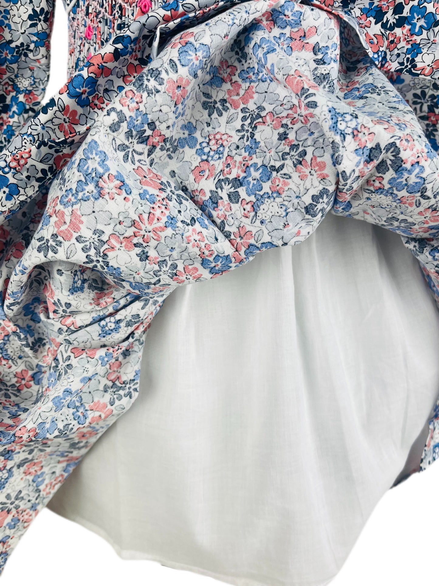 Milly hand smocked blue and pink floral long sleeve winter dress