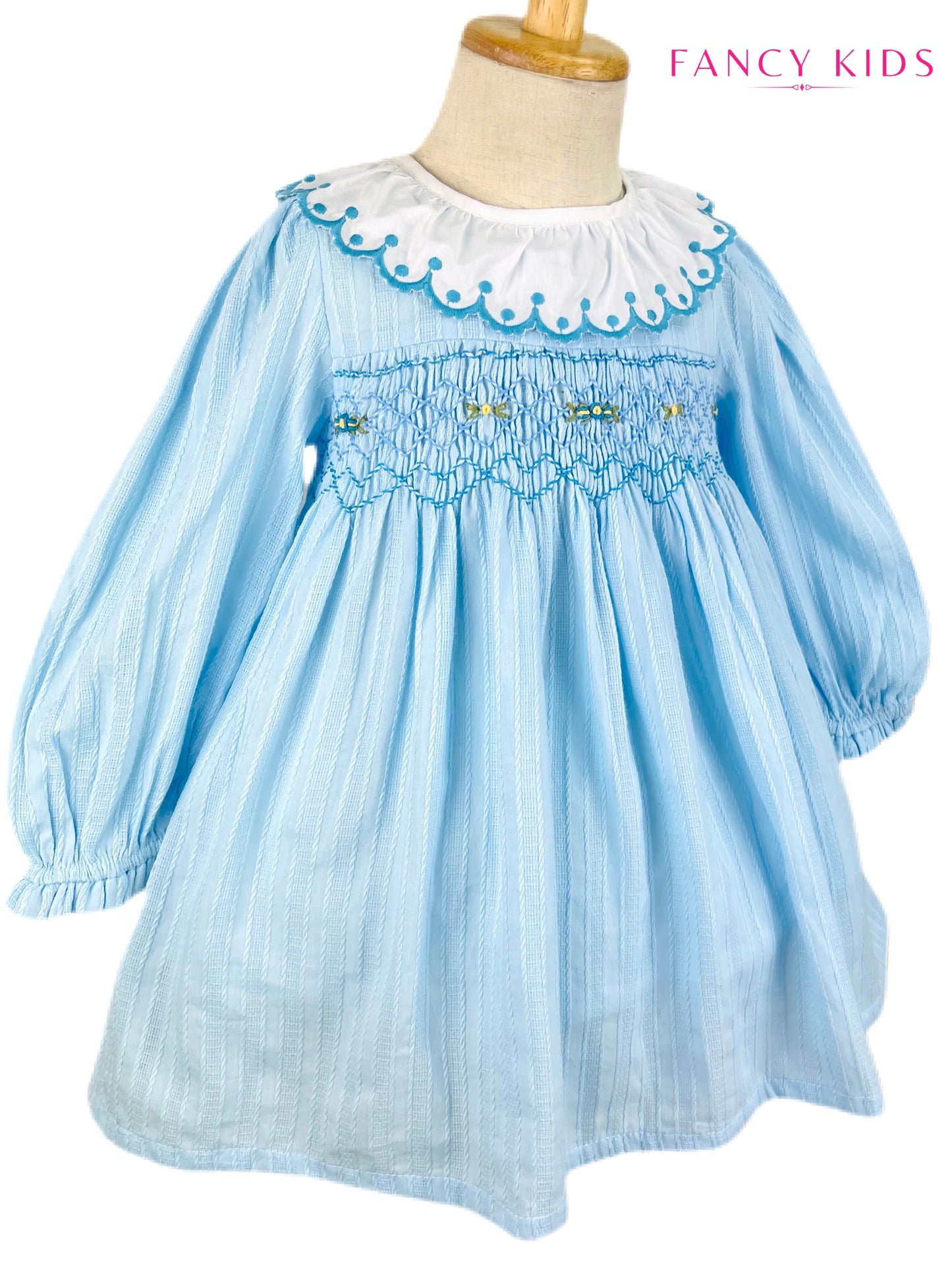 Arabella hand smocked Light blue long sleeve winter dress