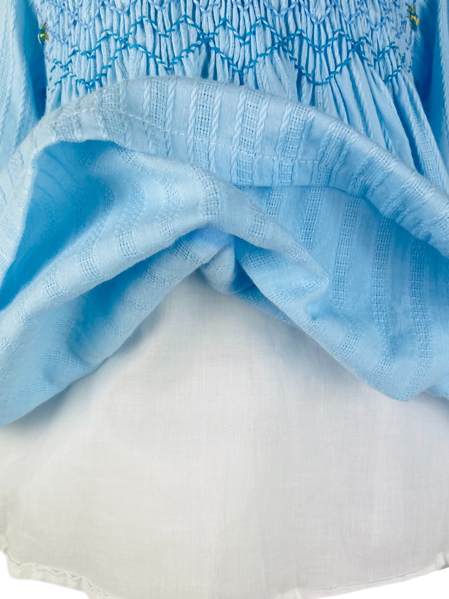 Arabella hand smocked Light blue long sleeve winter dress