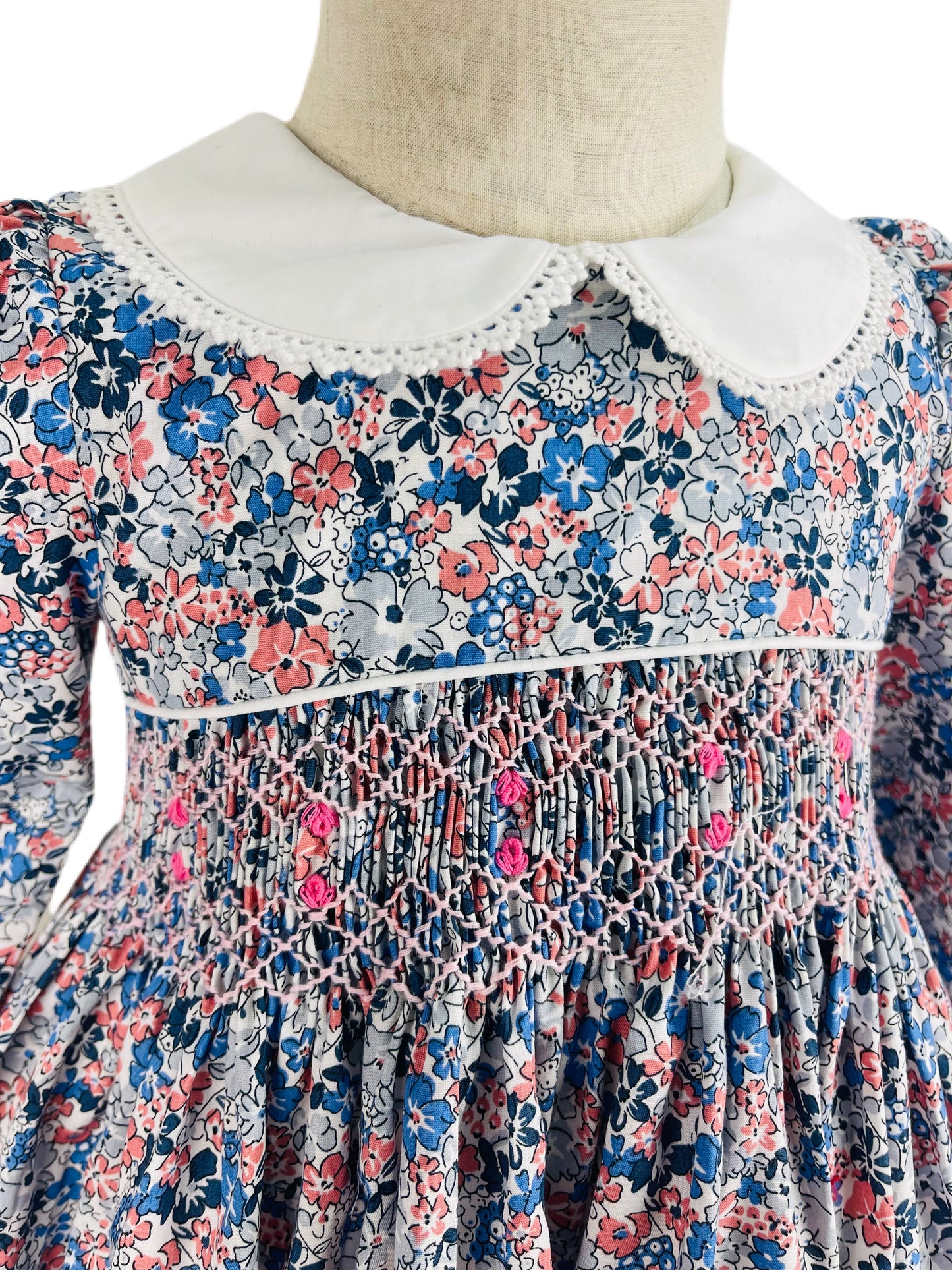 Milly hand smocked blue and pink floral long sleeve winter dress