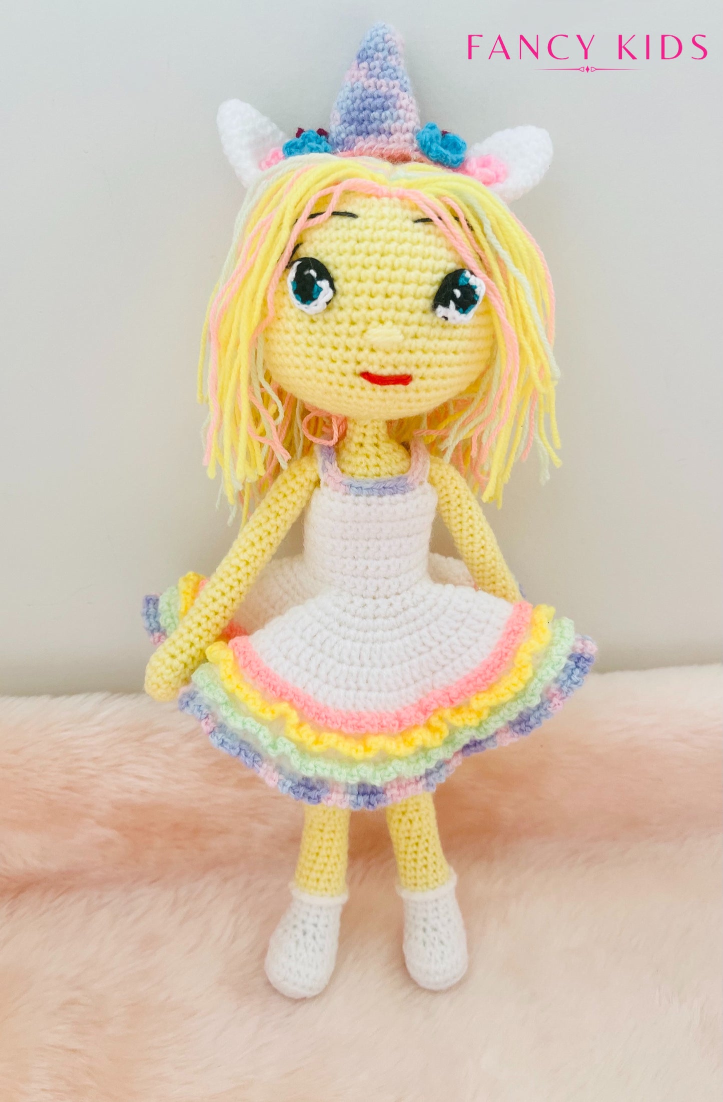 Hand knitted stuffed unicorn girl doll