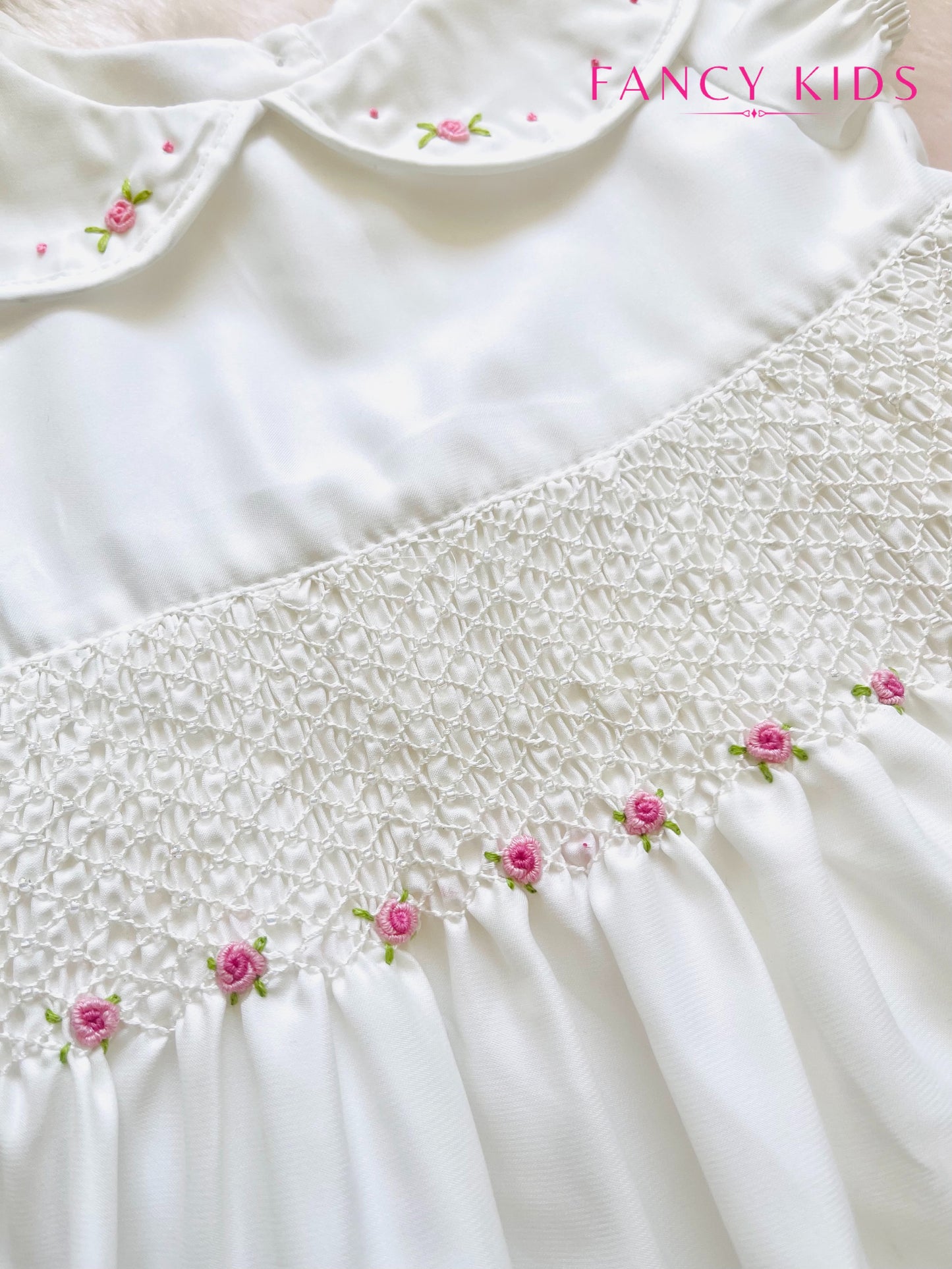 Hand smocked hand embroidered white dress with bead work