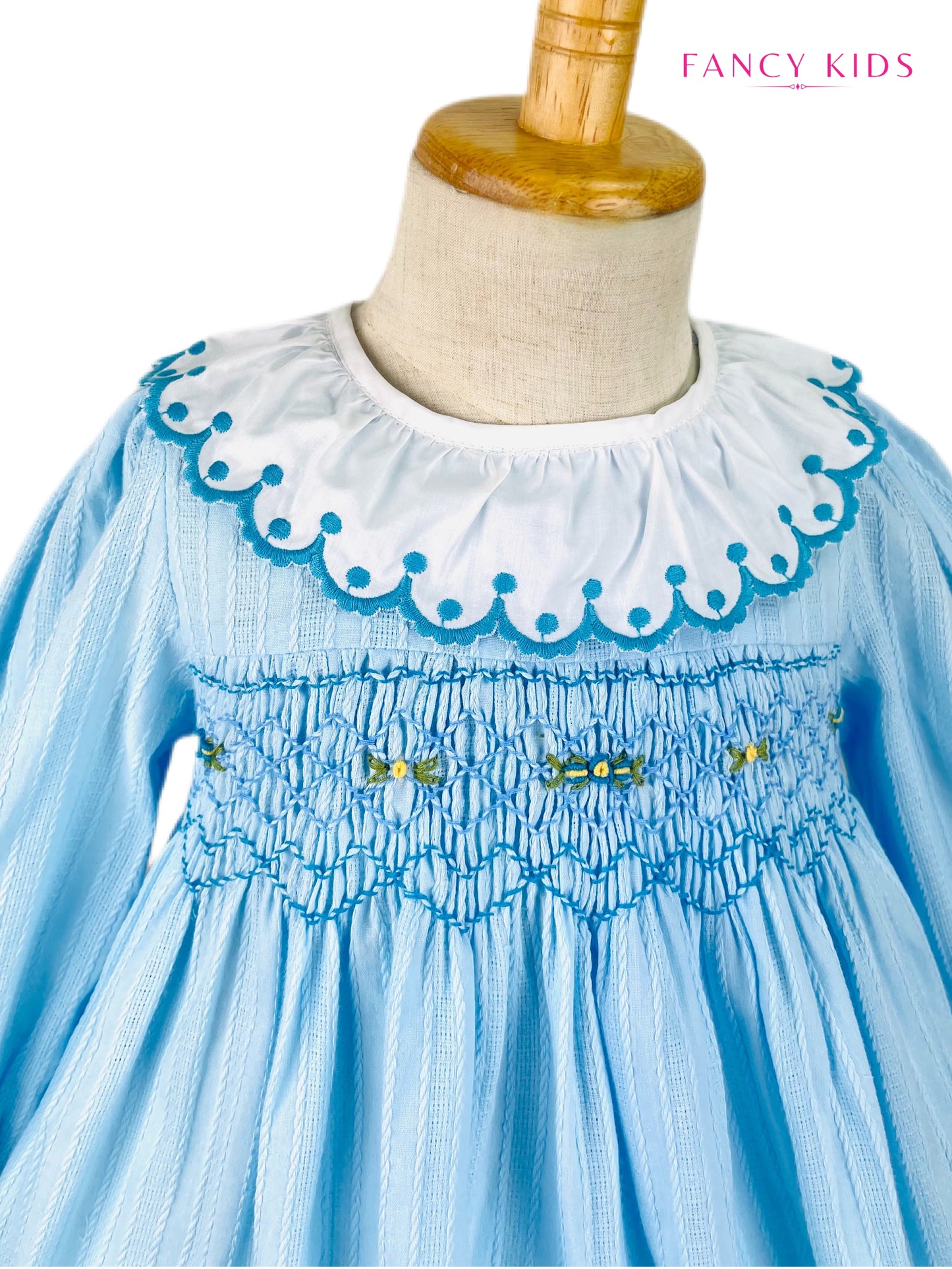 Arabella hand smocked Light blue long sleeve winter dress