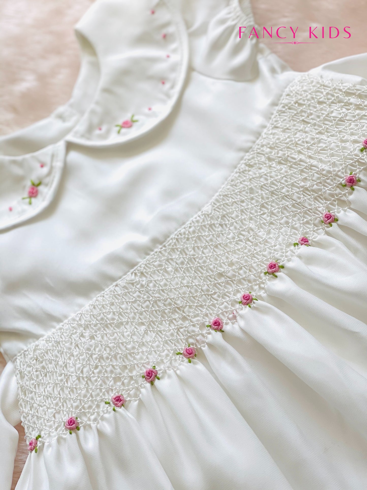 Hand smocked hand embroidered white dress with bead work