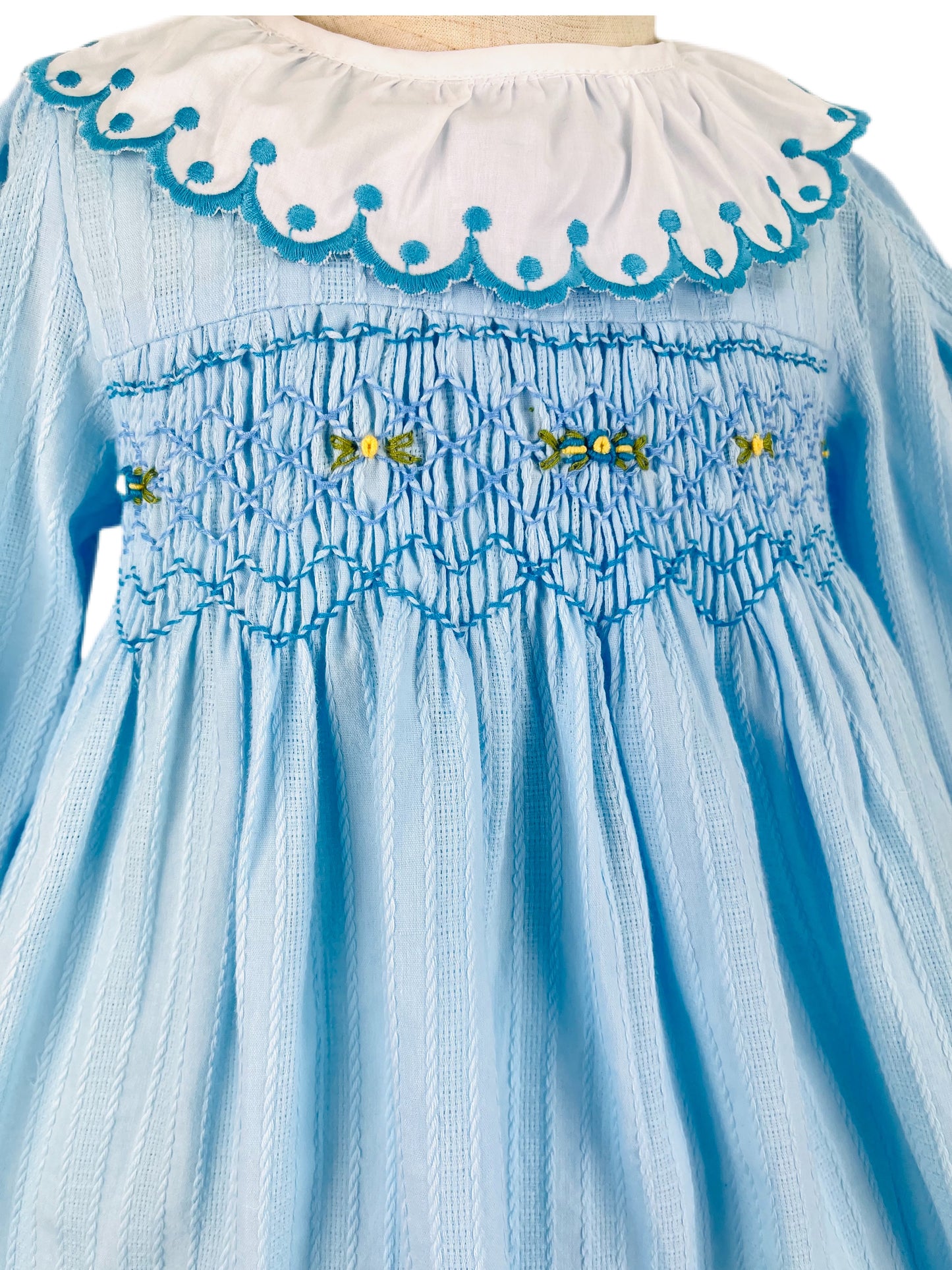 Arabella hand smocked Light blue long sleeve winter dress