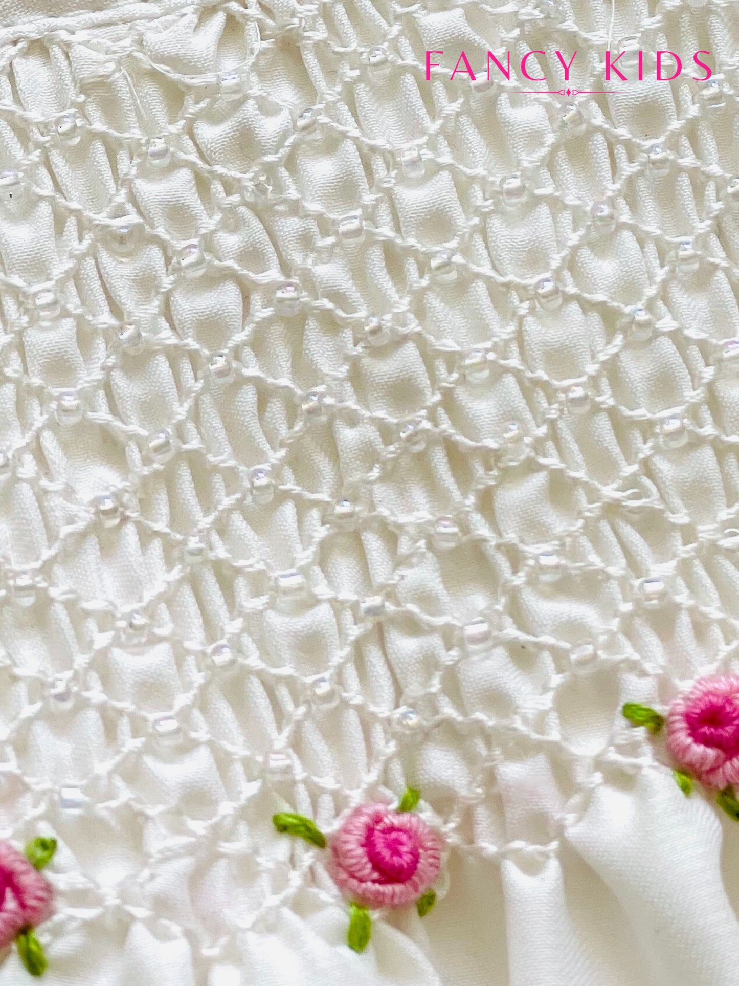 Hand smocked hand embroidered white dress with bead work