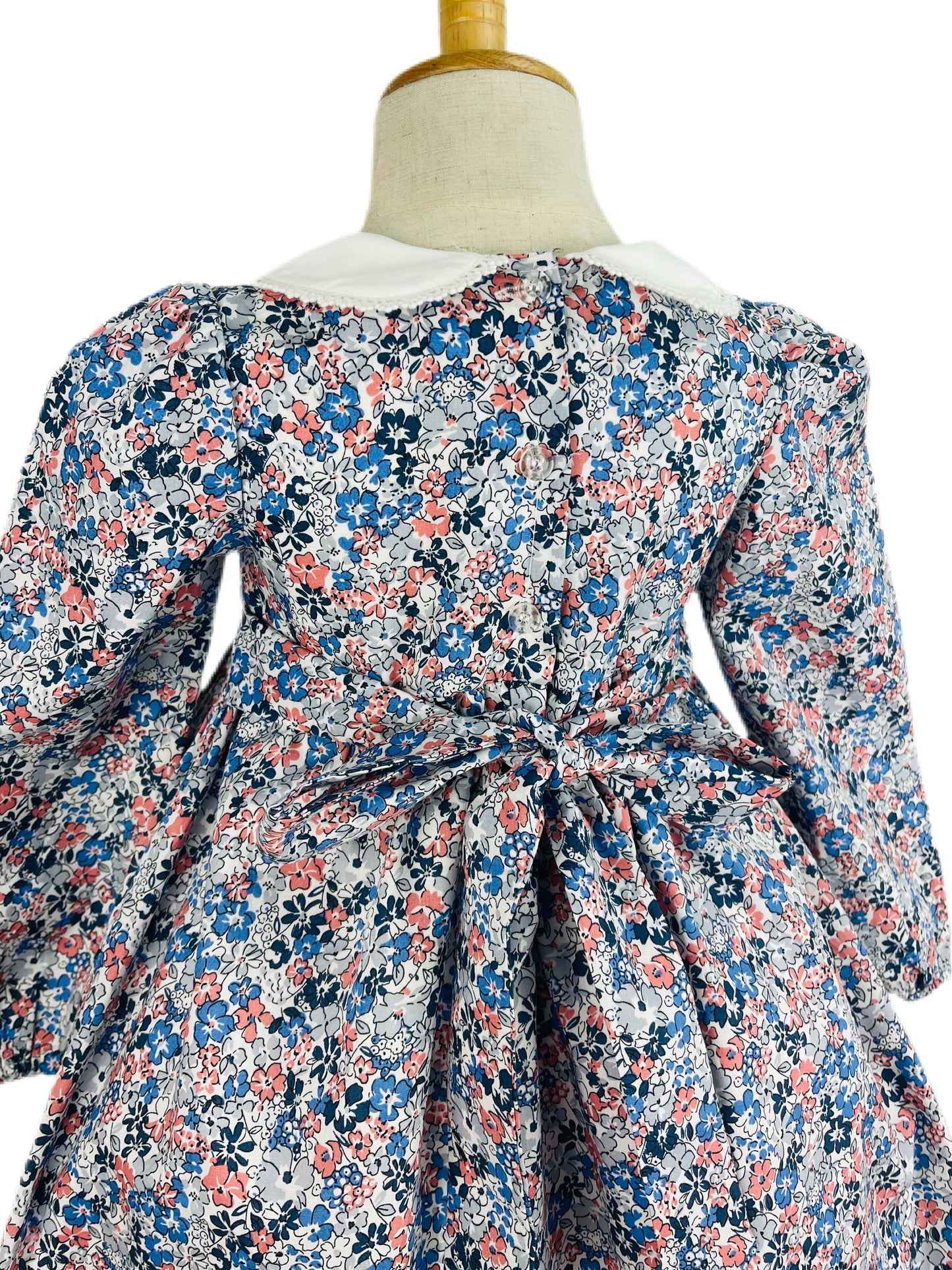 Milly hand smocked blue and pink floral long sleeve winter dress