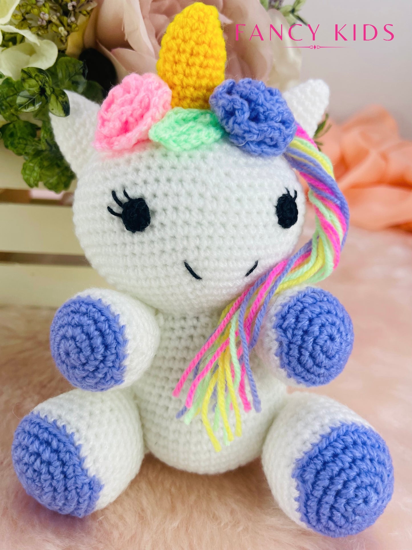Hand knitted plush unicorn toy