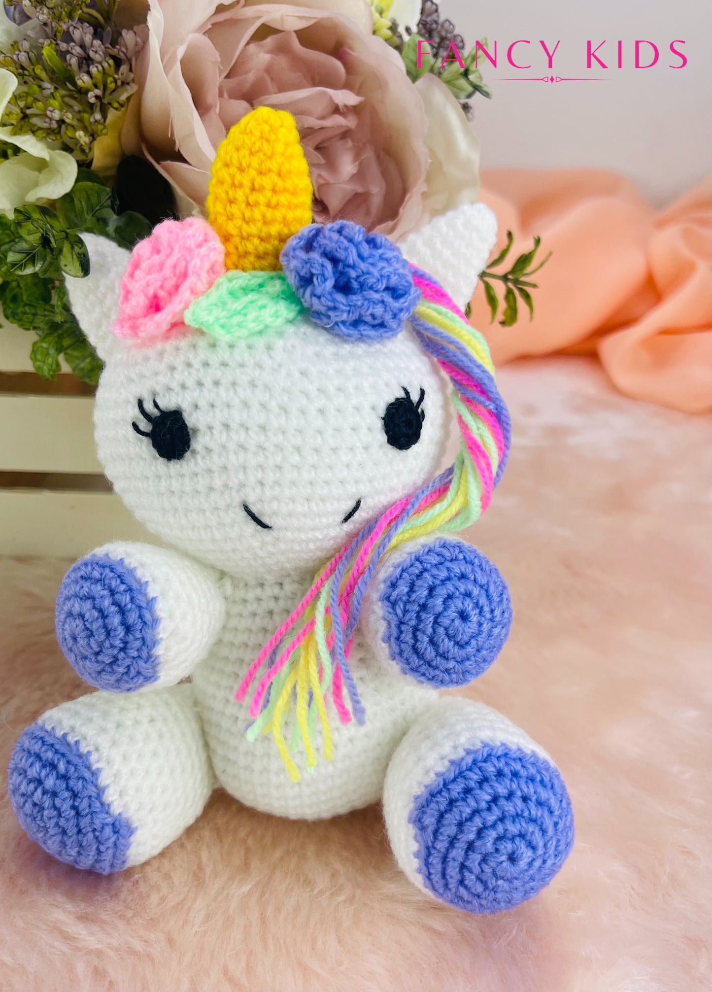 Hand knitted plush unicorn toy