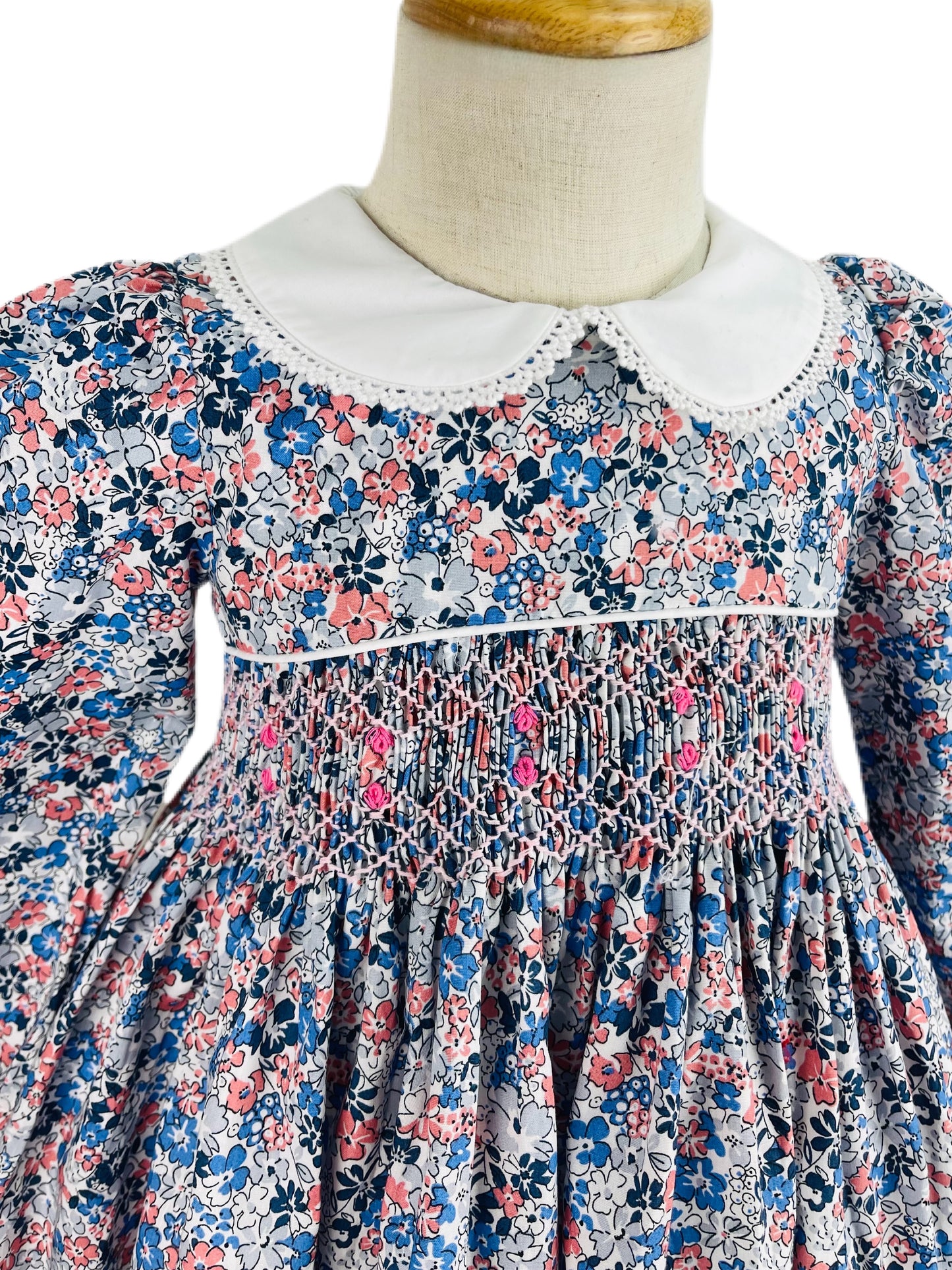 Milly hand smocked blue and pink floral long sleeve winter dress