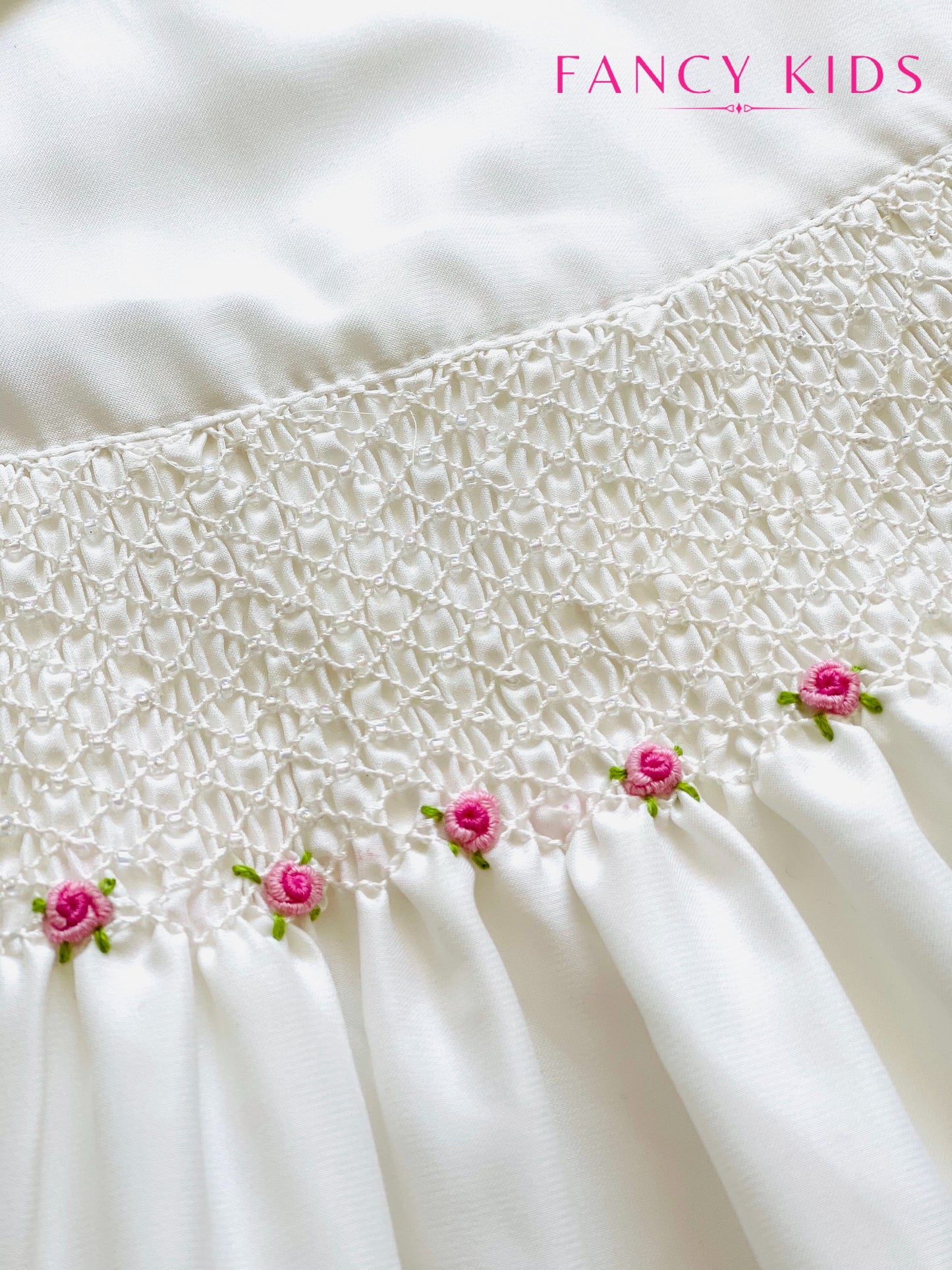 Hand smocked hand embroidered white dress with bead work